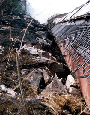 Figure 8 - Side of derailed car resting against a rock cut on the inside of the curve (south side of the main track)